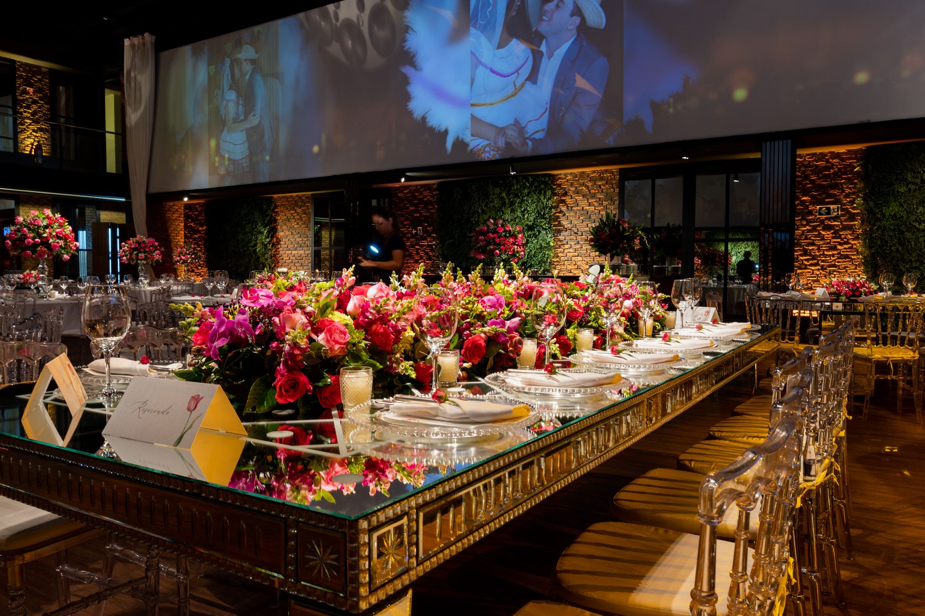 Luxurious wedding venue with vibrant floral table settings and elegant decor for a memorable celebration.