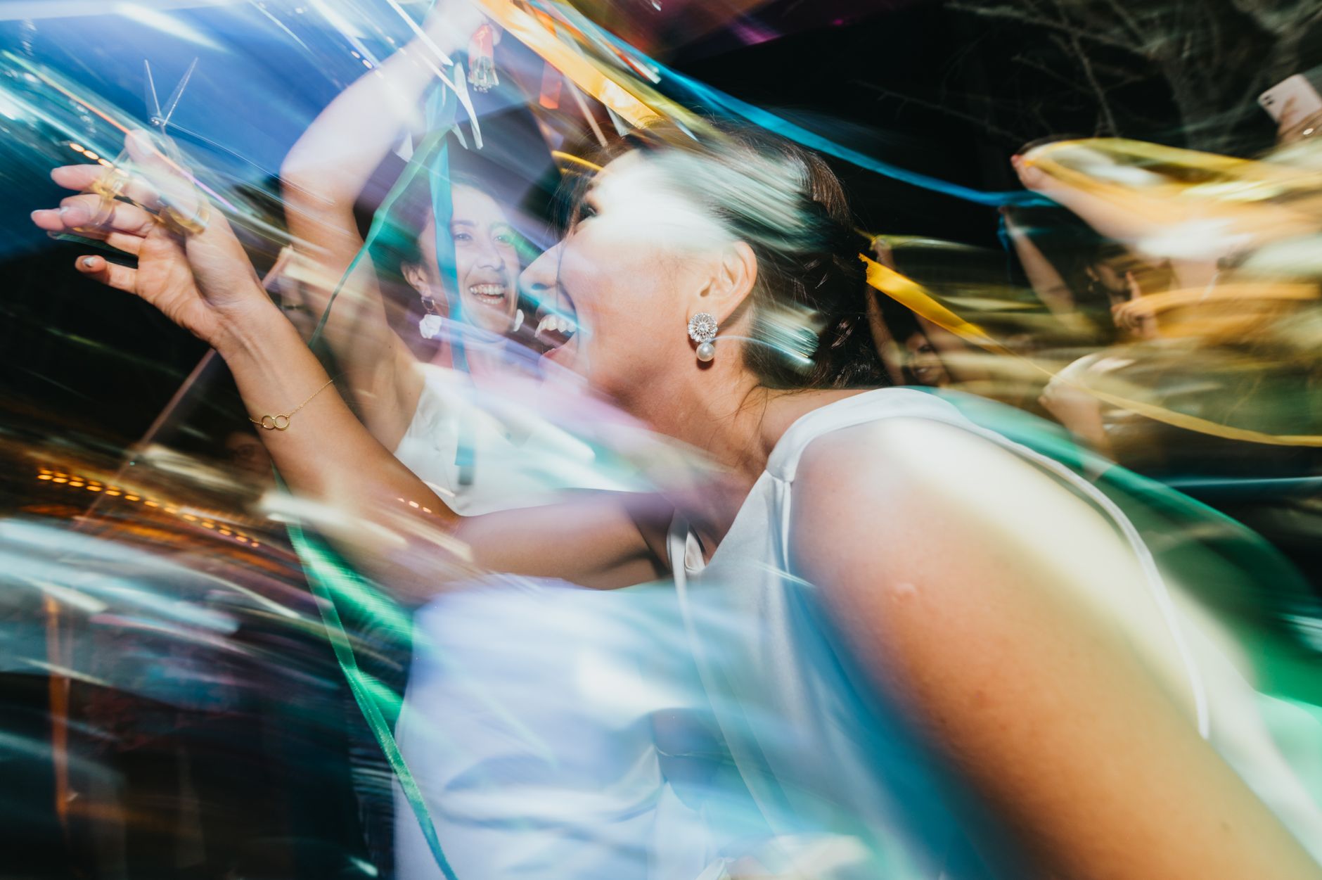 Joyful party scene with colorful motion blur and excitement.
