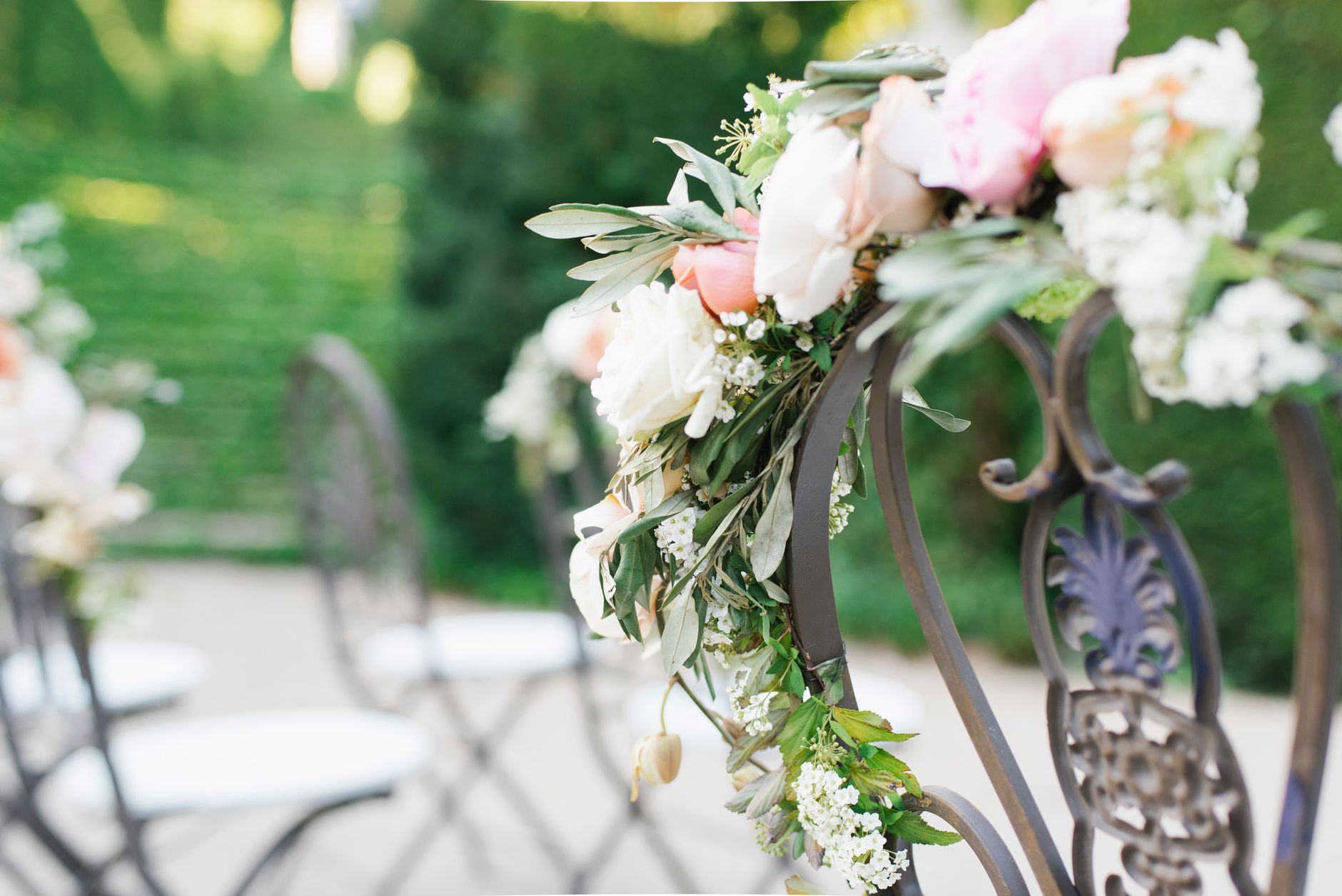 Wedding floral decor on a garden aisle with a romantic and elegant touch.