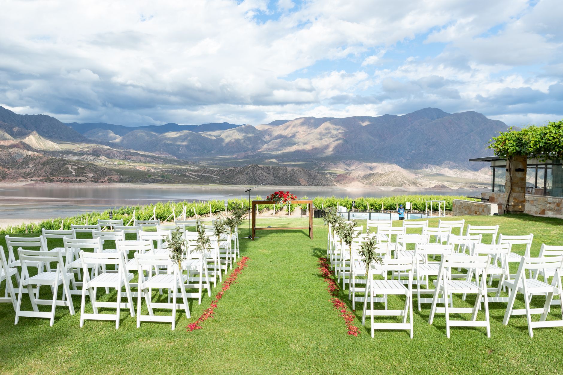 Beautiful outdoor wedding setting with chairs overlooking mountains in Mendoza, Argentina.